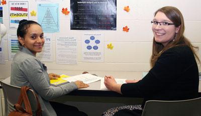 tutor helping student in the academic success center